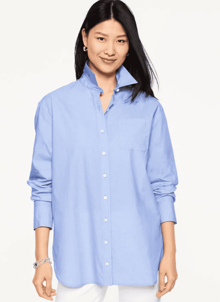 Woman wearing a blue button dowm.