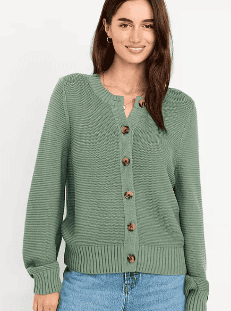 Woman wearing a green cardigan.