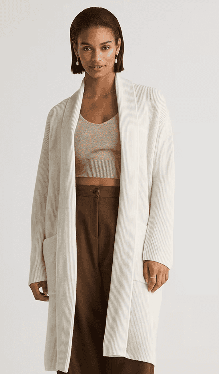 Woman wearing a long open-front merino wool duster cardigan