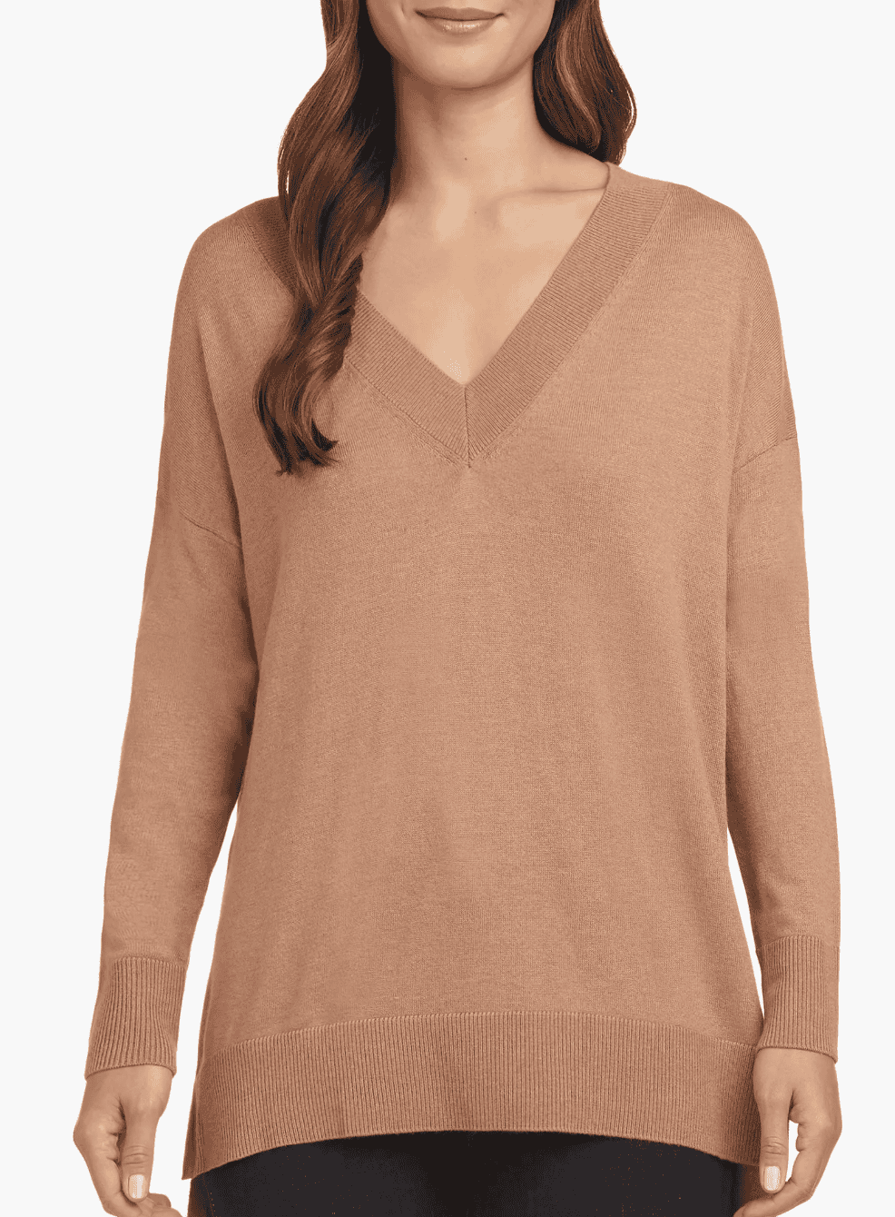 Woman wearing a long V-neck side slit sweater