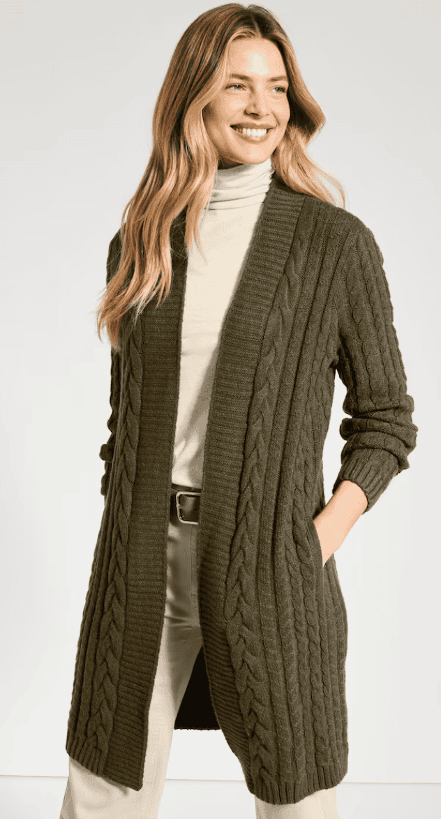 Woman wearing a long open-front cabled cardigan
